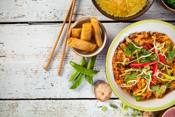 Wall Mural - Asian chicken curry and prawns with rice and sushi pieces