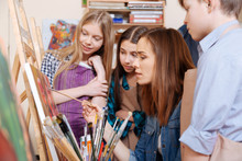 Involved Woman Teaching Young Generation In The Art School
