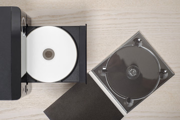 Listen to the music, white cd and black case, audio player.