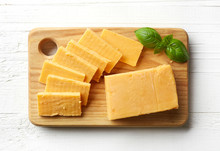 Piece And Slices Of Cheddar Cheese