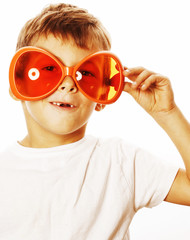 little cute boy in orange sunglasses pointing isolated close up 