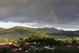 Fototapeta Tęcza - stunning rainbow over tropical rainforest landscape at costa verde, brazil