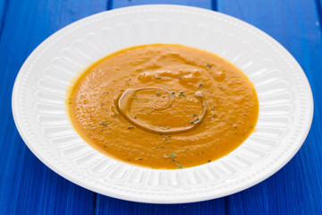 Poster - vegetable soup with oil on white dish