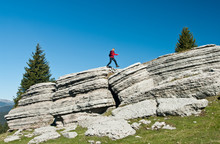 Hiker In The Mount Fior, The Rocky Garden Of Asiago Plateau, Italy,