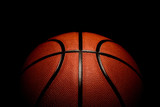 Fototapeta Sport - basketball on black background.