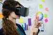 © WavebreakMediaMicro - Female graphic designer using the virtual reality headset