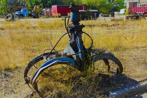 Fotografie, Obraz Old rusty hydraulic grapple to collect scrap metal