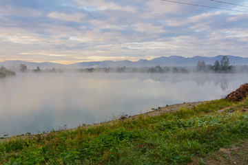 Wall Mural - Lake in the mountains for recreation and fishing. Early morning