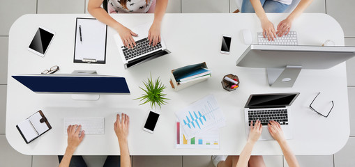 Canvas Print - People working with laptops on desk