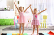 Cheerful little girls playing at home