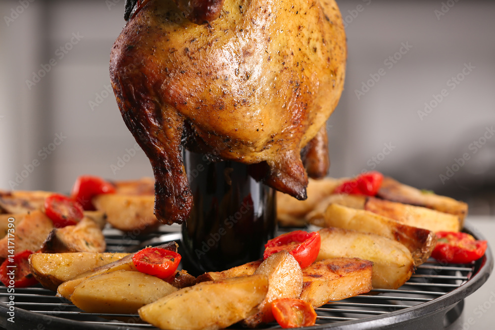 Grilled beer can chicken with garnish, closeup