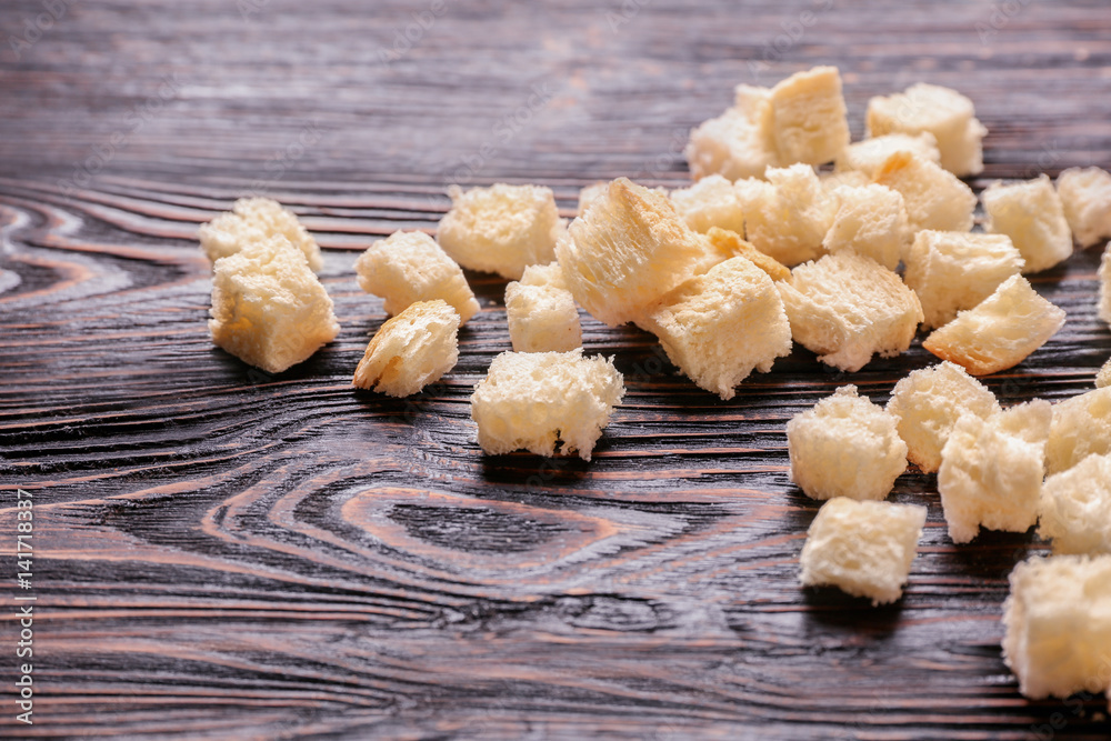 Bread pieces on wooden background