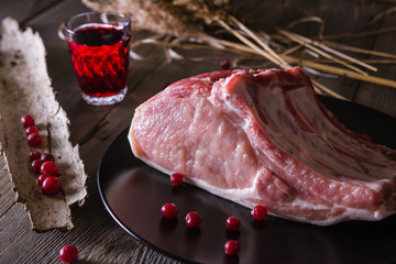 Wall Mural - Fresh game meat on a wooden table