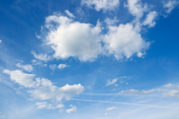 Wall Mural - White clouds in the blue sky. Cloudscape over horizon. Heaven.