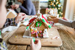 © Sarah Rypma - Children decorating a gingerbread house