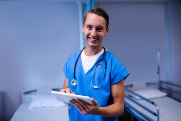 Wall Mural - Doctor using digital tablet in ward at hospital