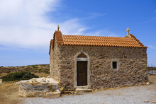 Small Chapel With Orange Tiles And A Blue Sky