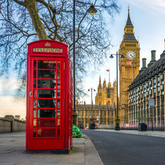 Poster - London, England - The iconic british old red telephone box with the Big Ben at background in the center of London