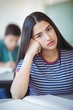 © WavebreakMediaMicro - Portrait of sad schoolgirl sitting in classroom