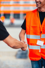 Construction workers handshaking