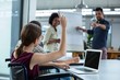 © WavebreakMediaMicro - Business executives discussing over flip chart during meeting