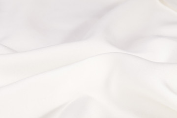 Silk background, texture of white shiny fabric