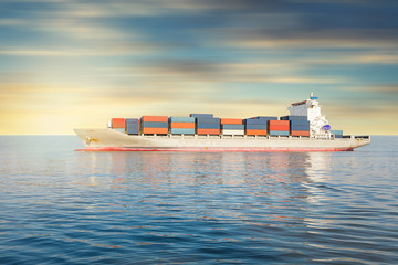 Cargo ship and cargo container in sea with clear sky background.