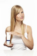 © sanneberg - Beautiful woman holding beauty product, portrait