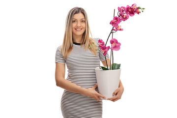 Poster - Young woman holding an orchid flower in a pot