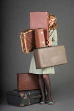 The Beautiful Woman With Old Retro Suitcases