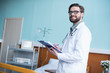 © LIGHTFIELD STUDIOS - Male doctor with clipboard