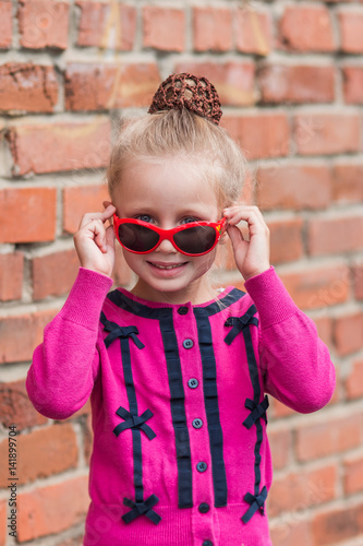 Cute Little Girl In Sunglasses Flirt