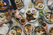© Cavan Images - Overhead view of friends having food at table