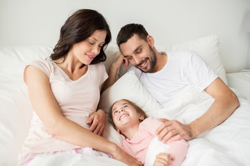 Sticker - happy family in bed at home