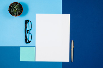 Poster - Mock-up magazine or catalog on colorful table. White page or notepad on modern background. Blank copy space for mockups or simulations.