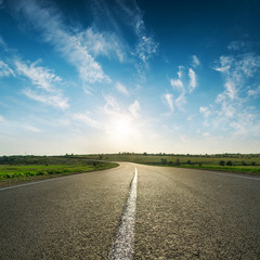 Wall Mural - sunset in blue sky over asphalt road