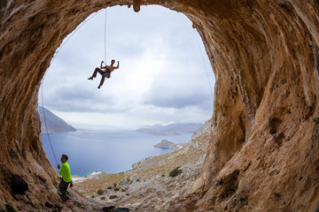 Wall Mural - Rock climbers in cave