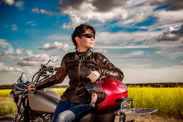 Wall Mural - Biker girl on a motorcycle