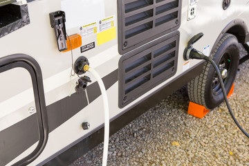  filling the water tank of a campervan