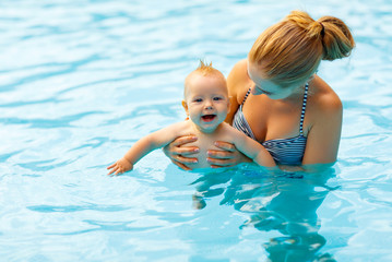 Poster - Mother and baby swim  in pool