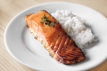 Poster - Delicious roasted salmon fillet with rice on white plate