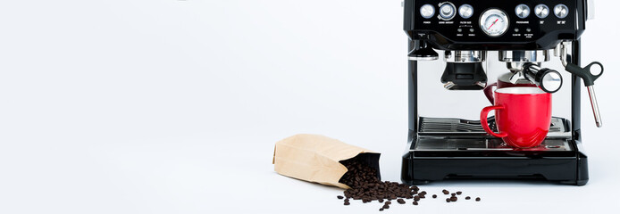 Banner with isolated black manual coffee maker with grinder and red coffee mug and bag of freshly roasted coffee beans on white background, header front view