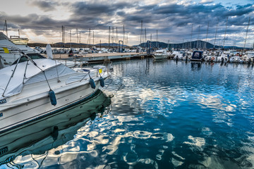 Wall Mural - Boats in Alghero harbor at sunset