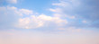 Sky background. Nature composition. Panoramic sunset sky background. Bright blue sky with lighted clouds. 