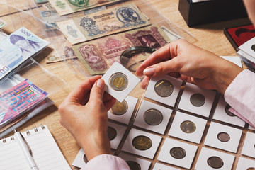 Zloty coin in the woman’s hand