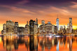 Sunset over New York City's Financial District as viewed from Brooklyn, with skyline reflections in East River