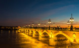 Fototapeta Paryż - Old stony bridge in Bordeaux