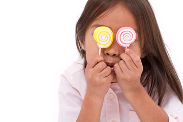 Wall Mural - cute little girl playing, eating sugar jelly sweet candy