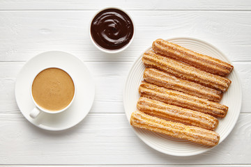 Wall Mural - churros traditional homemade spain street fast food baked sweet dough snack with chocolate and coffe