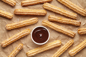 Wall Mural - churros traditional homemade spain street fast food baked sweet dough snack dessert with chocolate o